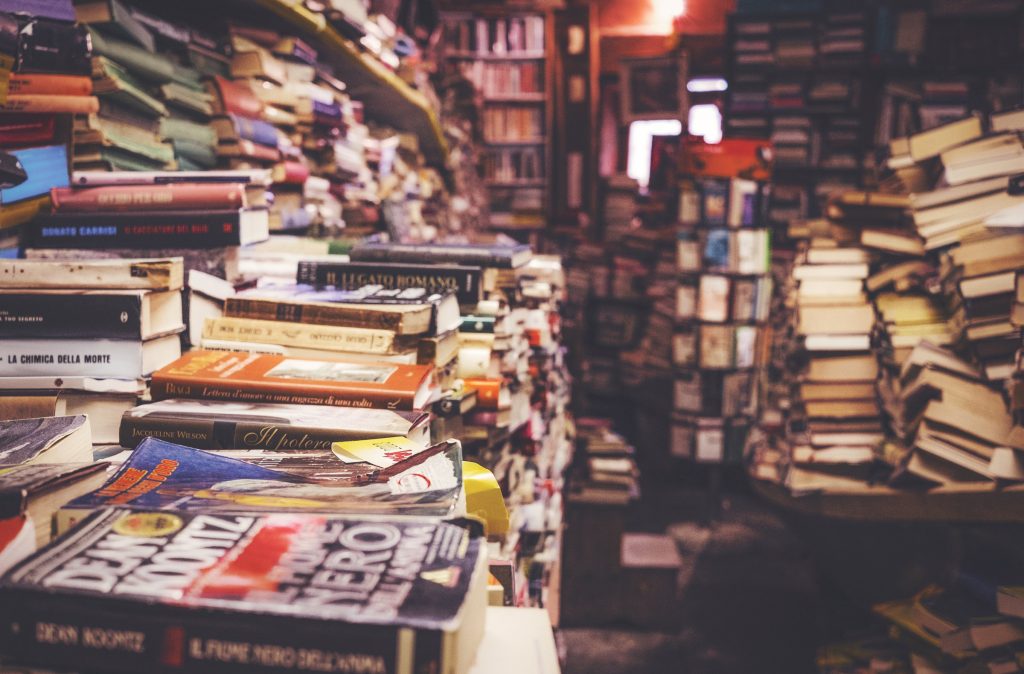 Stacks of second-hand books piled on tables